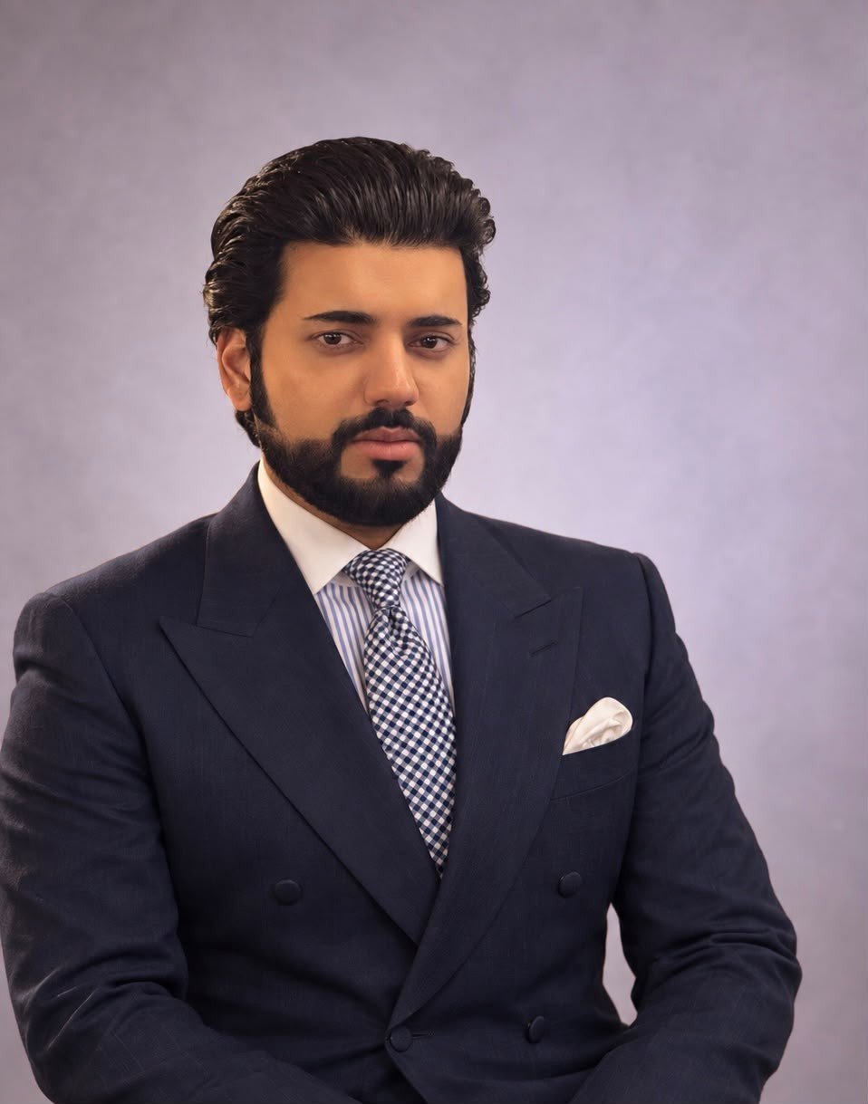 Manvedeep Singh in a navy double-breasted suit